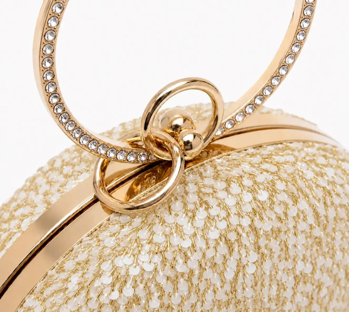 Gold sequined round clutch purse by The Tan Clan with shimmering, sparkly surface perfect for elegant occasions.