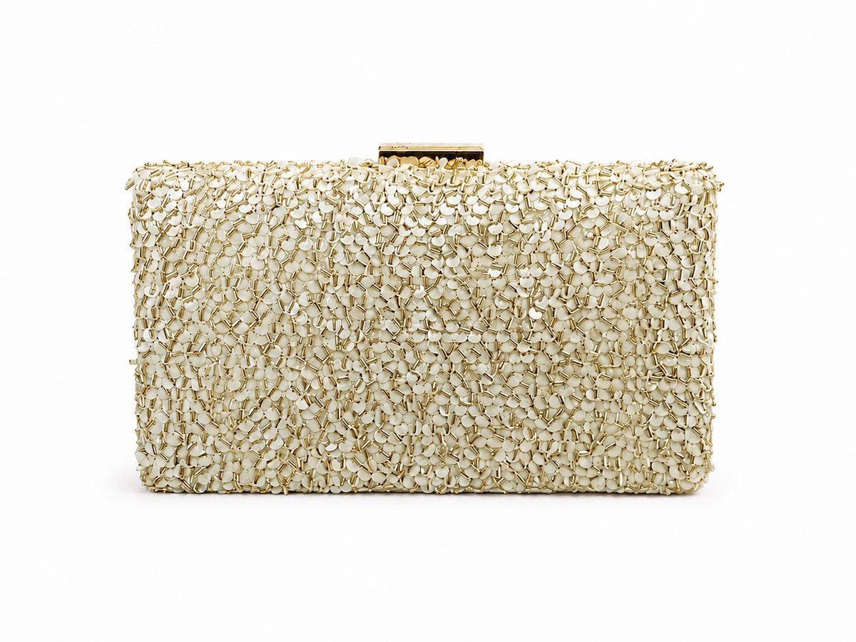 Gold sequined sleek clutch bag by The Tan Clan, featuring sparkling sequins and a compact elegant design for evening occasions.