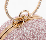 Dazzle Pink Sequined Round Clutch by The Tan Clan featuring shiny pink sequins and a compact, circular design.