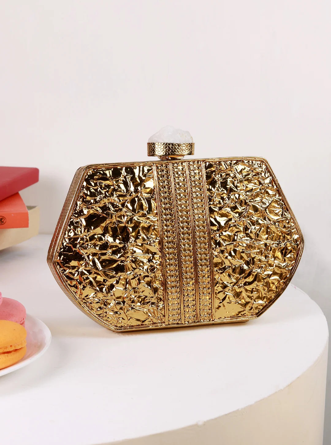 Demi Brass Clutch by The Tan Clan featuring a sleek, polished brass finish and elegant design for stylish occasions
