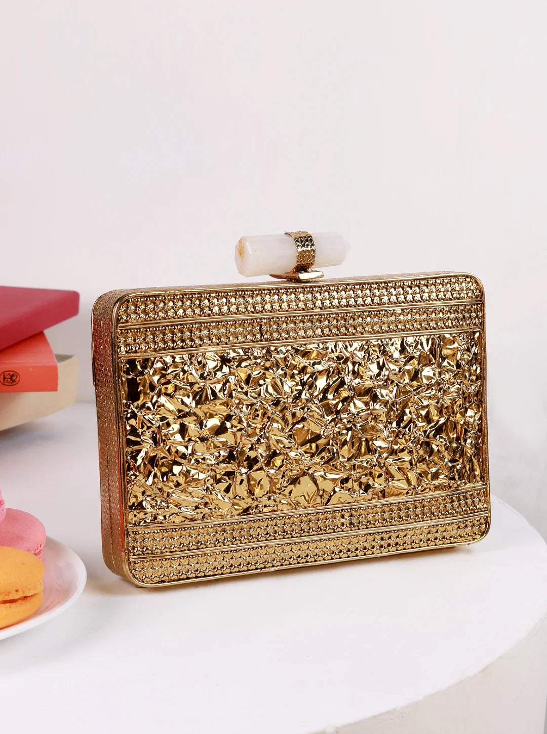 Dina Brass Clutch by The Tan Clan featuring a sleek brass finish and minimalist design for elegant evening wear.
