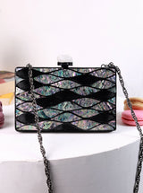 Eve Brass Clutch by The Tan Clan featuring a sleek, metallic design with a fold-over flap and minimalist style.