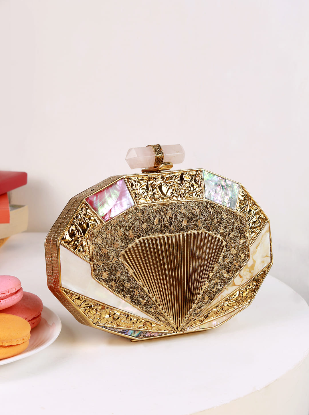 Giana Brass Clutch by The Tan Clan featuring a sleek, metallic brass finish and compact design for elegant evening accessories.