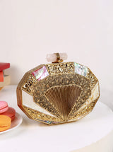 Giana Brass Clutch by The Tan Clan featuring a sleek, metallic brass finish and compact design for elegant evening accessories.