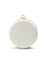 Round silver clutch purse by The Tan Clan with a shiny metallic finish, perfect for evening or special occasions.