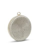 Silver round clutch purse by The Tan Clan featuring a shiny, metallic finish and compact design for elegant occasions.