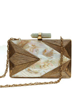 Krysty Mother of Pearl Brass Clutch by The Tan Clan showing a sleek, elegant clutch with mother of pearl and brass detailing