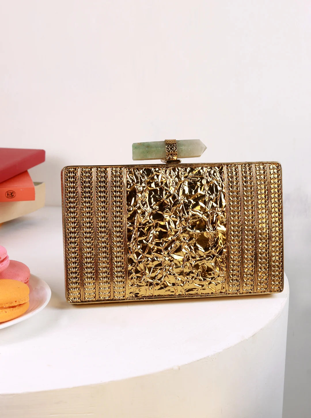Krysty Mother of Pearl Brass Clutch by The Tan Clan featuring a polished mother of pearl surface and elegant brass accents.