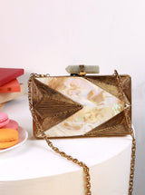 Krysty Mother of Pearl Brass Clutch by The Tan Clan featuring iridescent shell surface and elegant brass accents.
