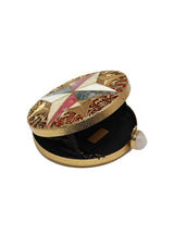 Lisa Golden Brass Clutch by The Tan Clan featuring a sleek, metallic gold design with a compact, elegant silhouette.