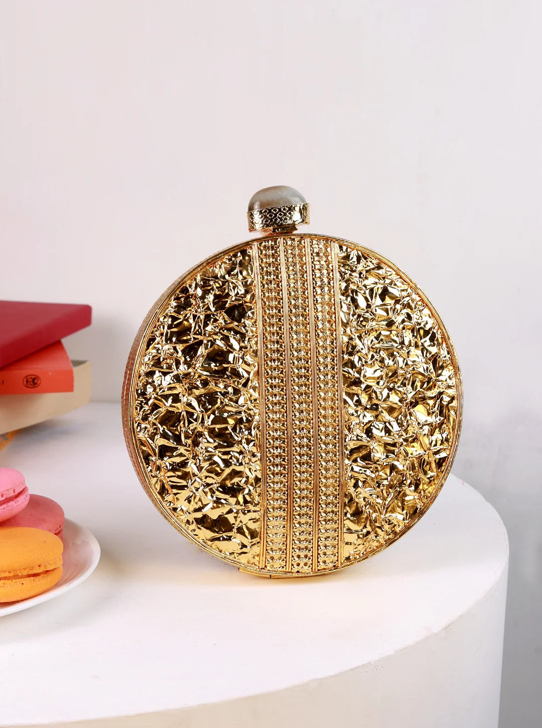 Lisa Golden Brass Clutch by The Tan Clan, showing a sleek gold and brass-colored clutch with a minimalist design.