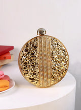 Lisa Golden Brass Clutch by The Tan Clan, showing a sleek gold and brass-colored clutch with a minimalist design.