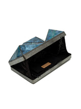 Mindy 3D Brass Clutch from The Tan Clan featuring a stylish 3D brass design and sleek clutch body for elegant occasions.