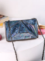 Mindy 3D Brass Clutch by The Tan Clan featuring geometric 3D design, sleek brass finish, and elegant handheld style.