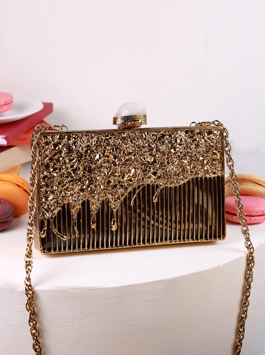 Nayla Brass Clutch by The Tan Clan featuring a sleek brass finish and elegant design, perfect for evening occasions.