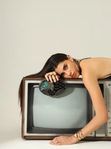 Nina Brass Clutch by The Tan Clan featuring a sleek, metallic design with a fold-over flap and minimalist style.