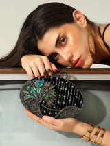Nina brass clutch from The Tan Clan featuring a sleek, stylish design with brass detailing and a compact, elegant shape.
