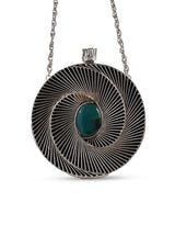 Black brass clutch bag by The Tan Clan, featuring a sleek compact design with a modern, elegant look.