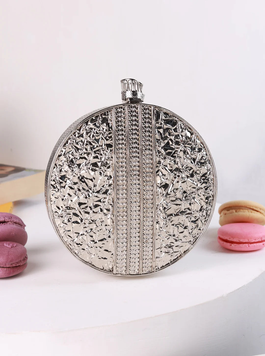 Black brass clutch bag from The Tan Clan featuring a sleek, minimalist design for elegant occasions.