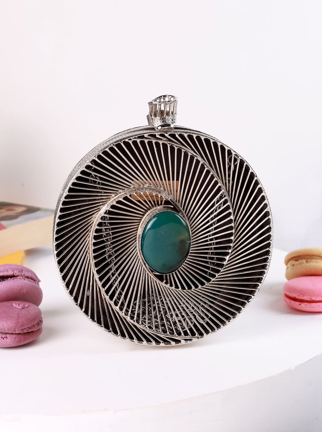 Black brass clutch bag from The Tan Clan featuring a sleek, minimalist design with a subtle metallic finish.
