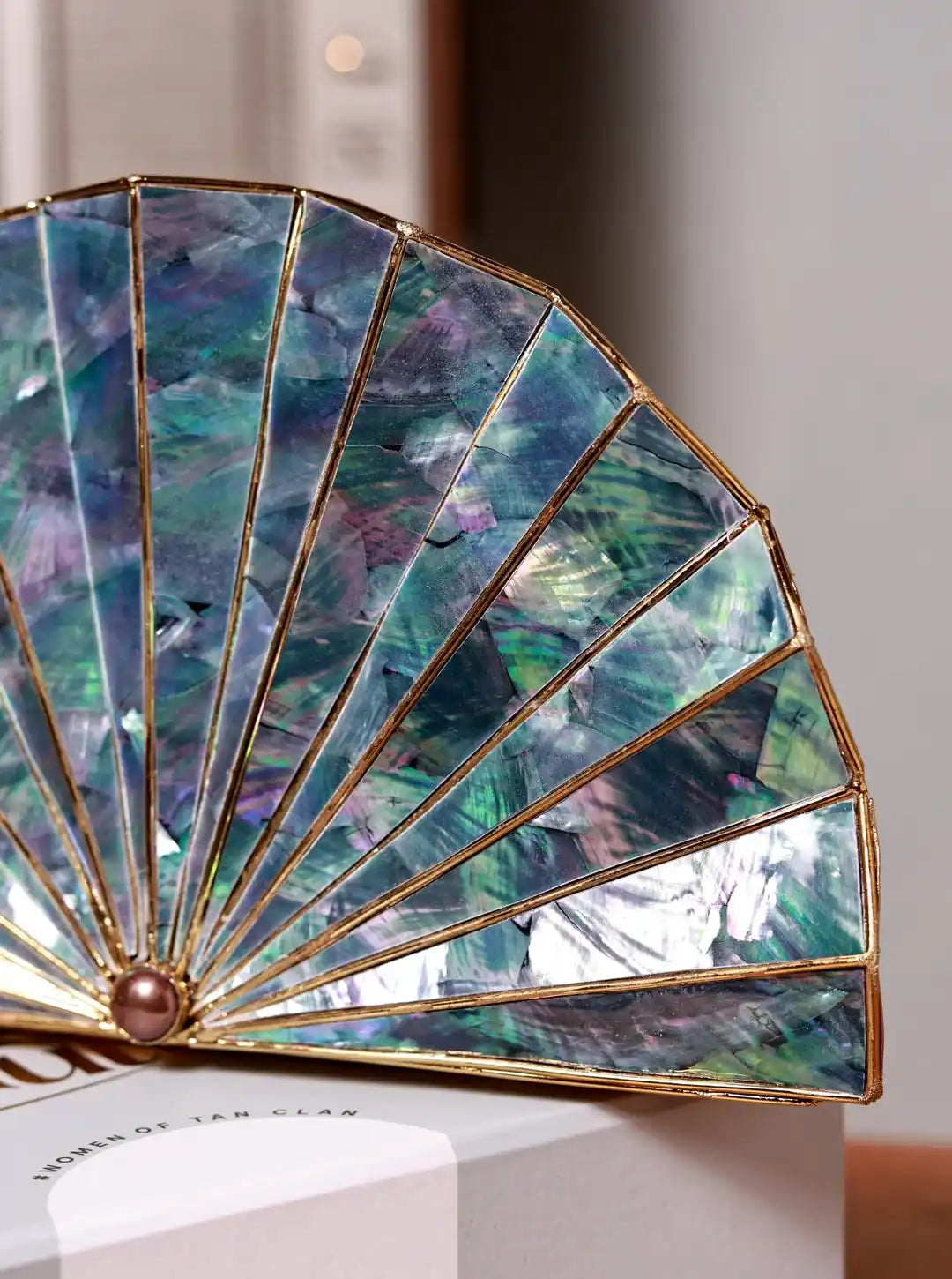 Opal brass clutch bag with a sleek design, featuring a polished finish and compact size, by The Tan Clan.