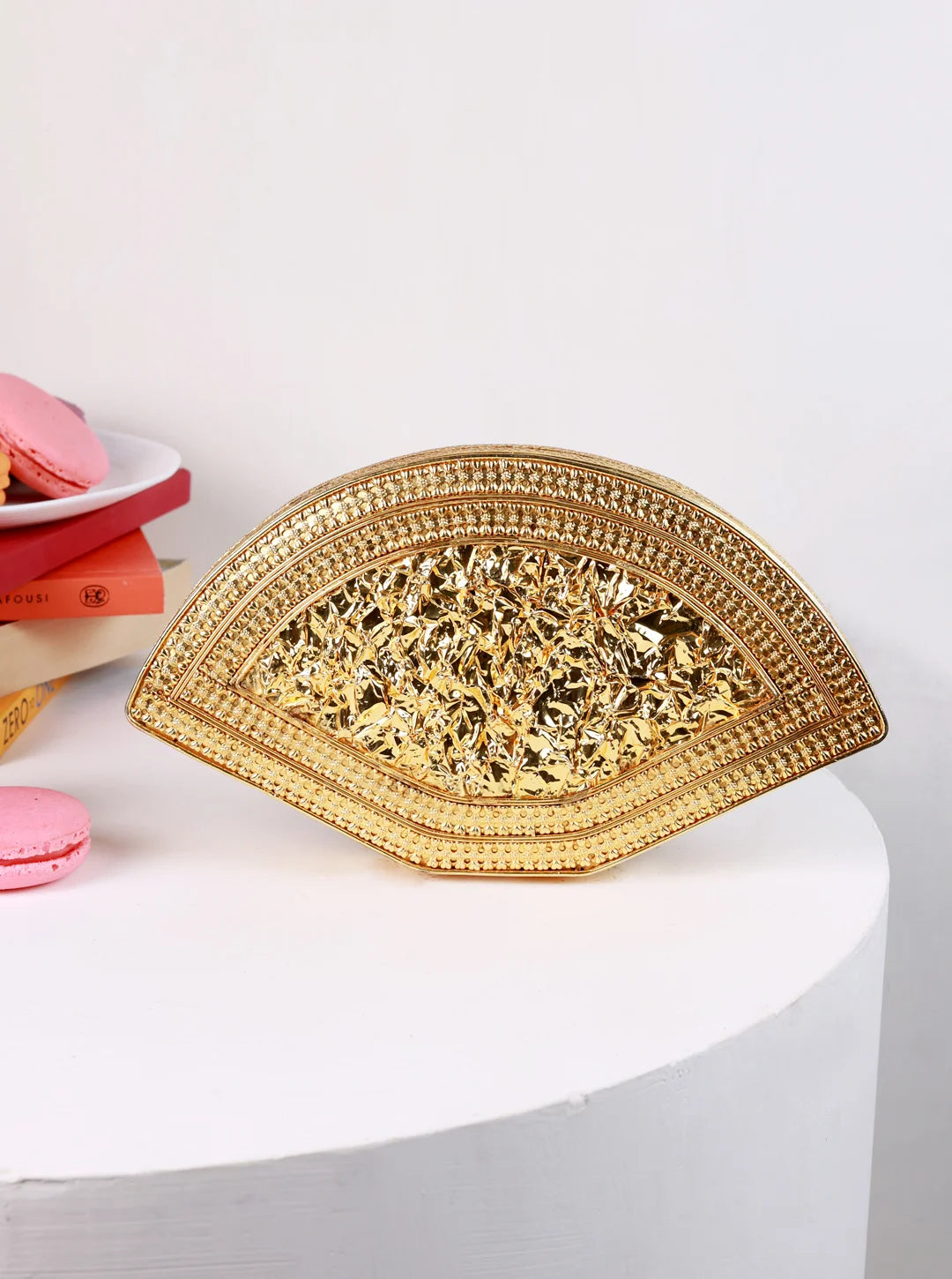 Multicolor brass clutch bag by The Tan Clan, featuring a stylish design and compact size for elegant evening accessories.