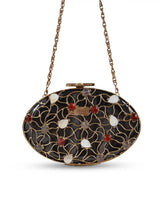 The Tan Clan Rhea Brass Clutch featuring a sleek metallic finish and elegant design for stylish evening accessories.