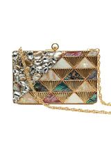 Brass clutch purse with intricate embellishments from The Tan Clan, featuring a sleek design and decorative details.
