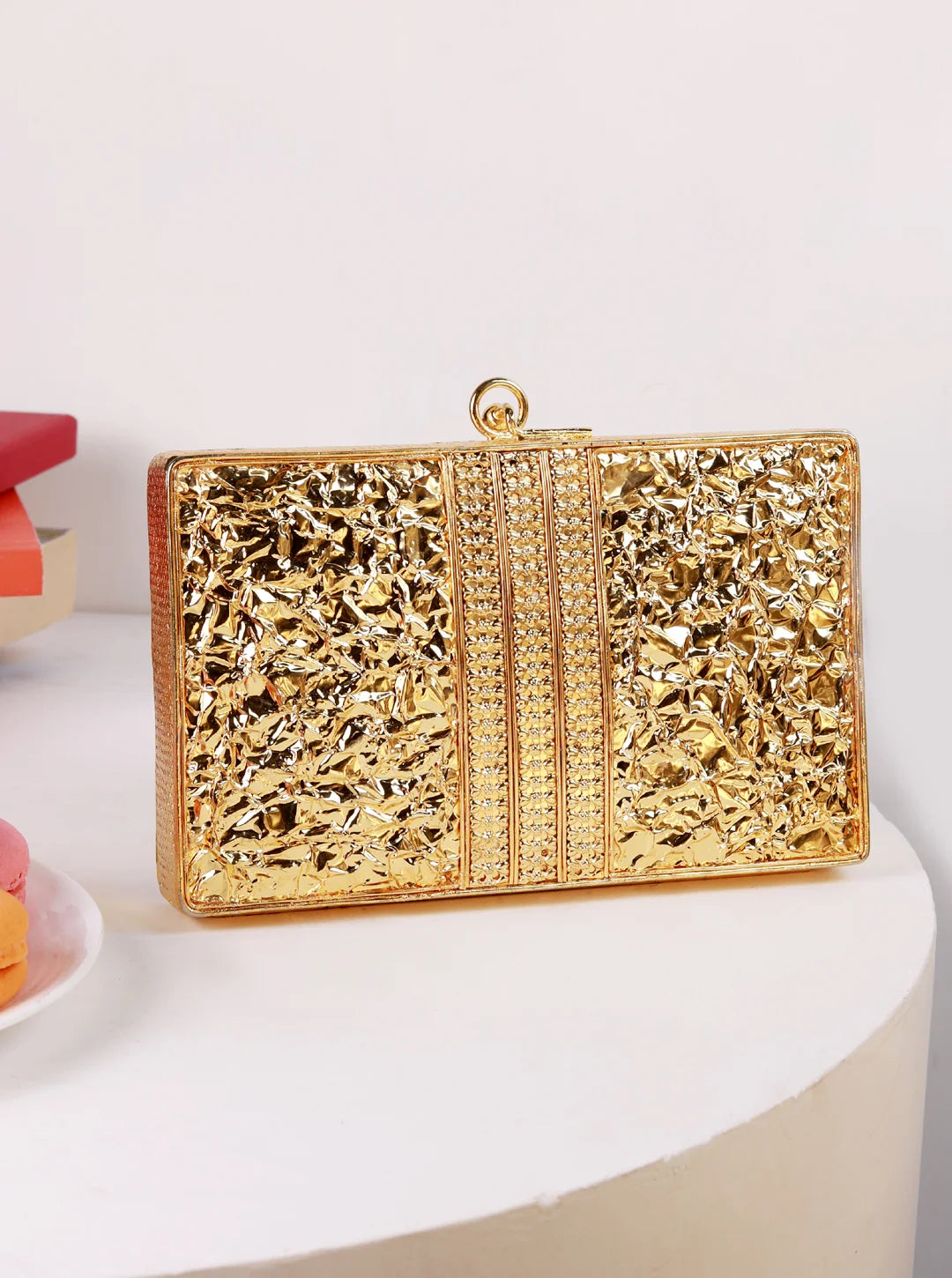 Rumi embellished brass clutch by The Tan Clan featuring intricate detailing and a sleek design for elegant occasions.