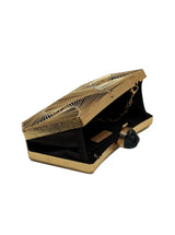 Ruth wired brass clutch by The Tan Clan featuring a sleek, structured design and metallic finish for elegant accessorizing.