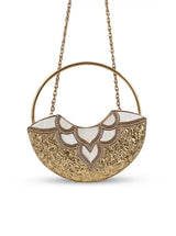 Sasha brass clutch with handle by The Tan Clan, featuring a sleek metallic finish and a compact design for elegant events.