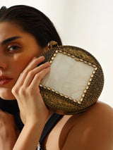Seren Brass Clutch by The Tan Clan featuring a sleek brass design with a minimalist style for elegant occasions.