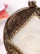 Seren brass clutch by The Tan Clan featuring a sleek, polished design with a gold finish and compact size.