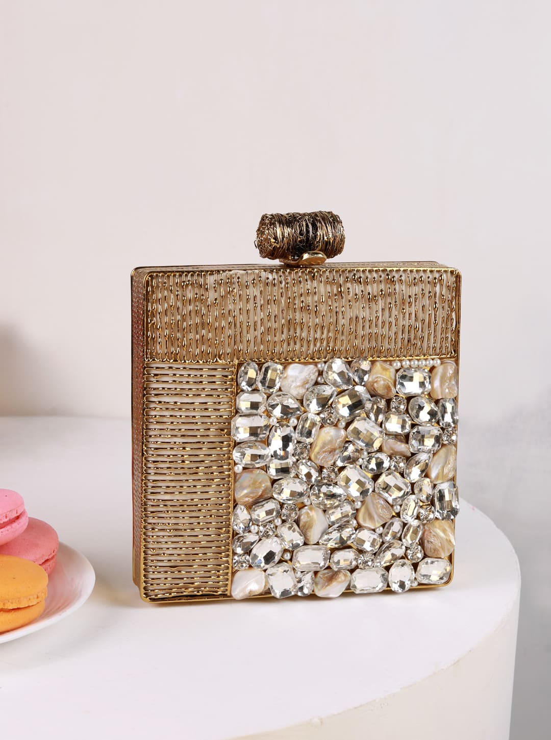 Sugar-embellished brass clutch bag by The Tan Clan, featuring intricate design and compact style for elegant occasions.