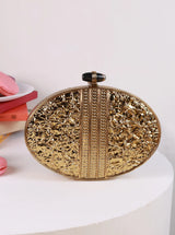 The Tan Clan Tracy Brass Clutch featuring a sleek, metallic finish and compact design, perfect for evening accessories.