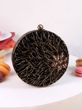Vana Brass Clutch by The Tan Clan featuring a sleek, polished brass surface and compact design for elegant evening use.