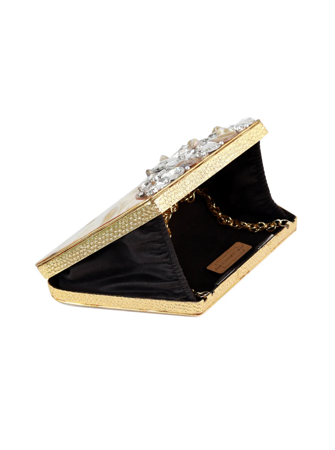 Vixi embellished brass clutch by The Tan Clan showing a stylish metallic clutch with decorative embellishments and a sleek design.
