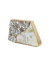 Vixi embellished brass clutch bag by The Tan Clan featuring intricate details and a sleek, elegant design for evening occasions.