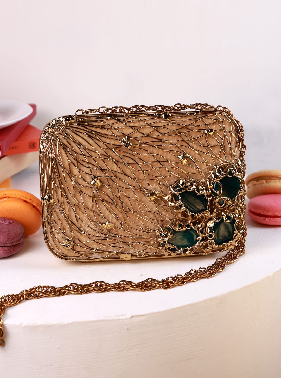 Zen Brass Clutch from The Tan Clan, featuring a sleek brass finish and compact design, perfect for elegant evening accessories.