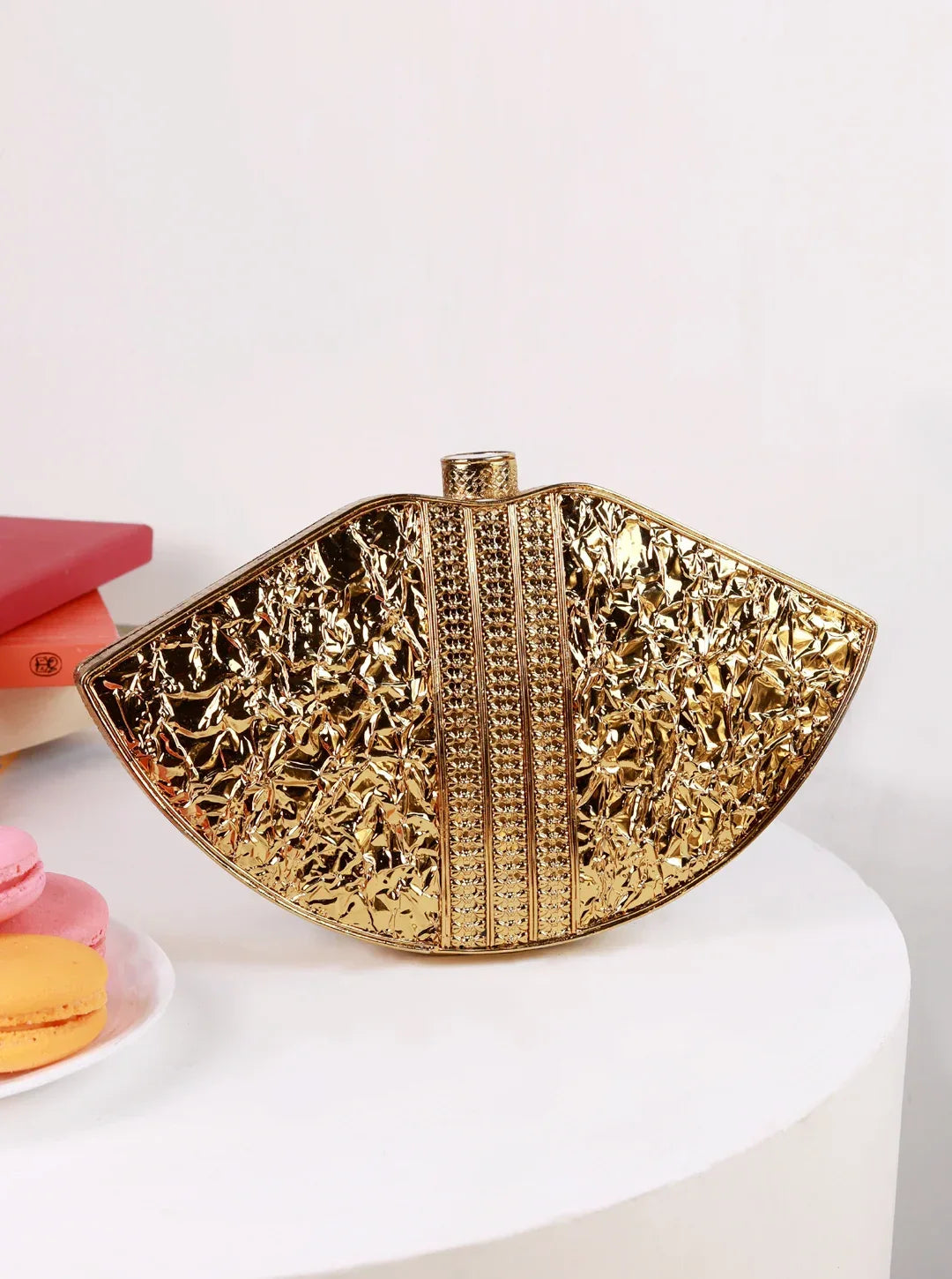Zuri Mother of Pearl Brass Clutch by The Tan Clan featuring a sleek design with pearl accents and brass details.