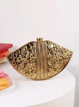 Zuri Mother of Pearl Brass Clutch by The Tan Clan featuring a sleek design with pearl accents and brass details.