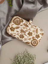 Beige Aabish hand-embroidered clutch bag by The Tan Clan with intricate embroidery and elegant design.