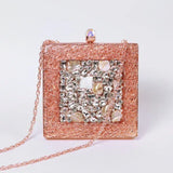 Embellished brass clutch bag with intricate detailing from The Tan Clan, featuring a stylish and elegant design.