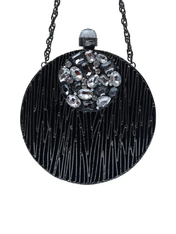 Aashna round brass clutch with embellishments, stylish accessory featuring intricate detailing and a polished finish.