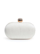 A coordinated set featuring a gold Swarn mini lotus potli and a white Zardozi Elizah clutch with intricate embroidery.