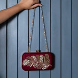 Afrah Hand Embroidered Leaf Clutch by The Tan Clan featuring intricate embroidery and a stylish leaf design.