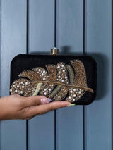 Black Afrah hand embroidered leaf clutch by The Tan Clan with pearl accents and Batua bag design.