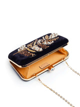 Black Afrah hand embroidered leaf clutch by The Tan Clan with pearl accents and Batua bag design.