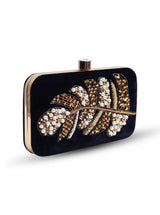 Afrah hand embroidered leaf clutch by The Tan Clan with black fabric, pearl accents, and intricate leaf embroidery.