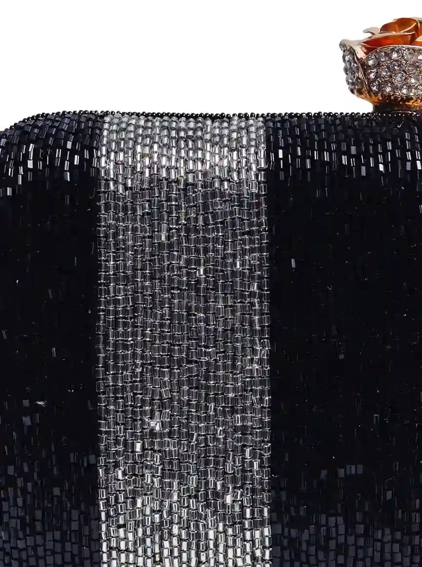 Afshaan hand embroidered clutch by The Tan Clan featuring intricate embroidery and a sleek, compact design for elegant occasions.